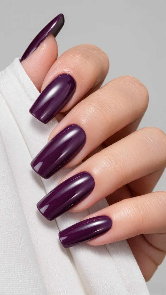 High-Gloss Deep Plum Stiletto Nails