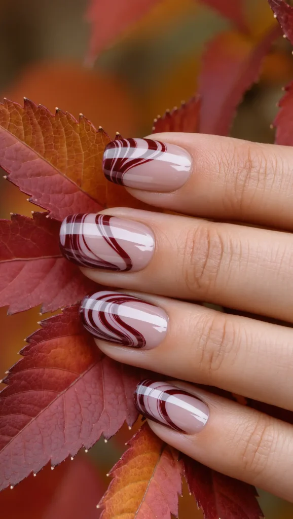 25 Fall Swirl Nail Ideas 2026: Artistic Manicures with a Cozy Autumn Twist 6 Burgundy Silk Waves